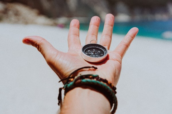 Person holding a compass