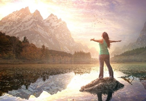 A person in nature with arms open wide
